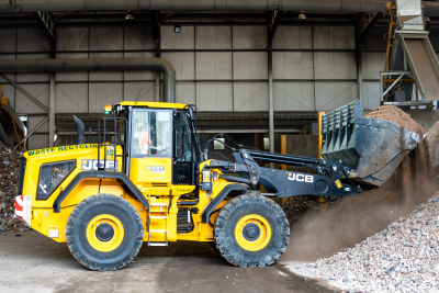 Yellow digger in a shed.