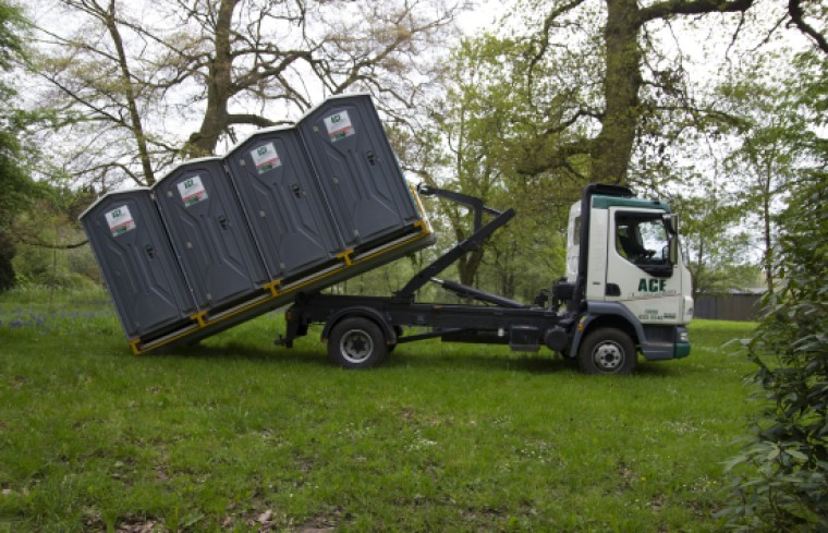 Lorry dropping loos off.